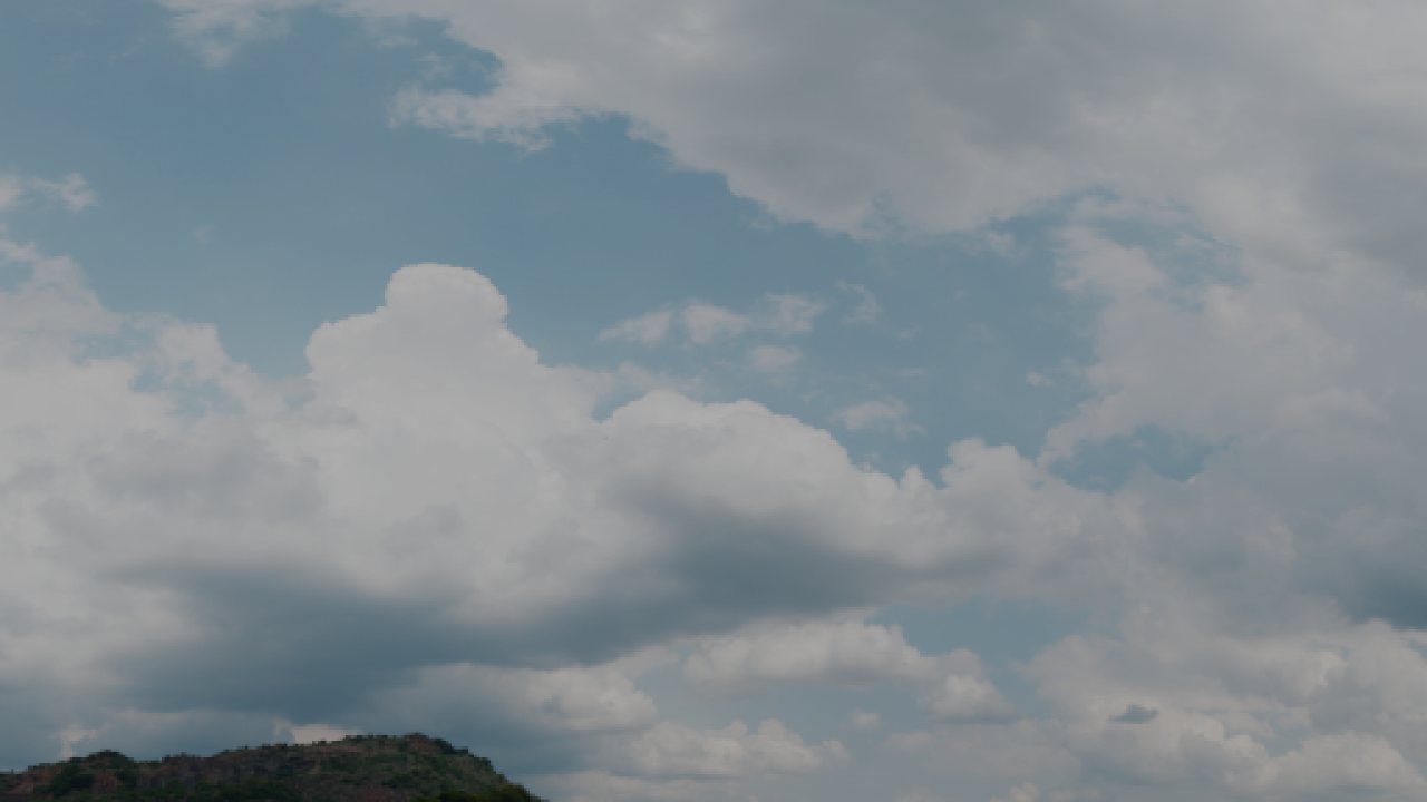Source plate: bright cumulus tops merged into one white mass